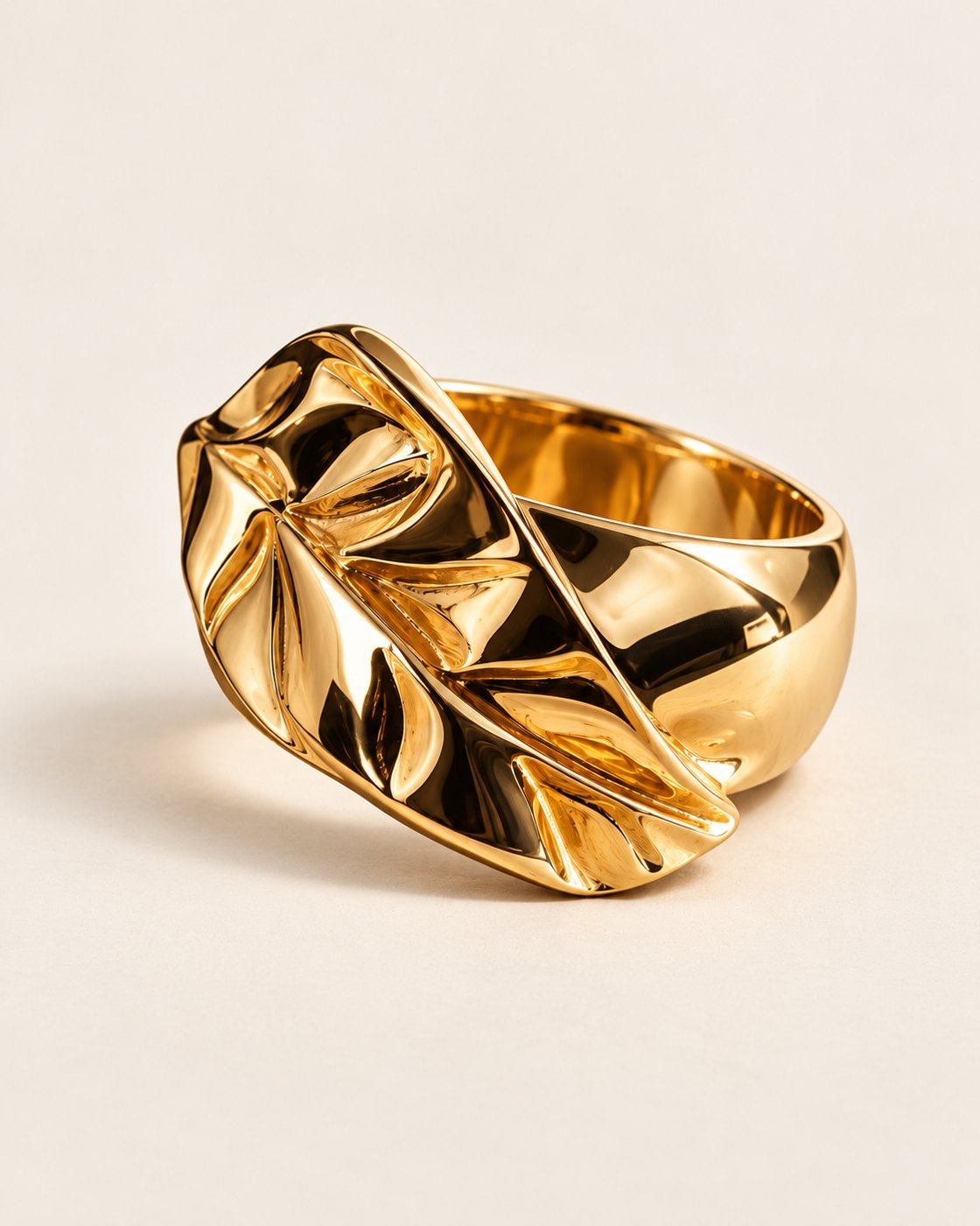 W.Ritzdorf sculptural gold leaf ring in a studio product photograph