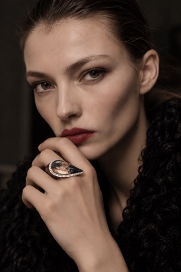 W.Ritzdorf editorial portrait of a woman wearing a sculptural statement ring near her face